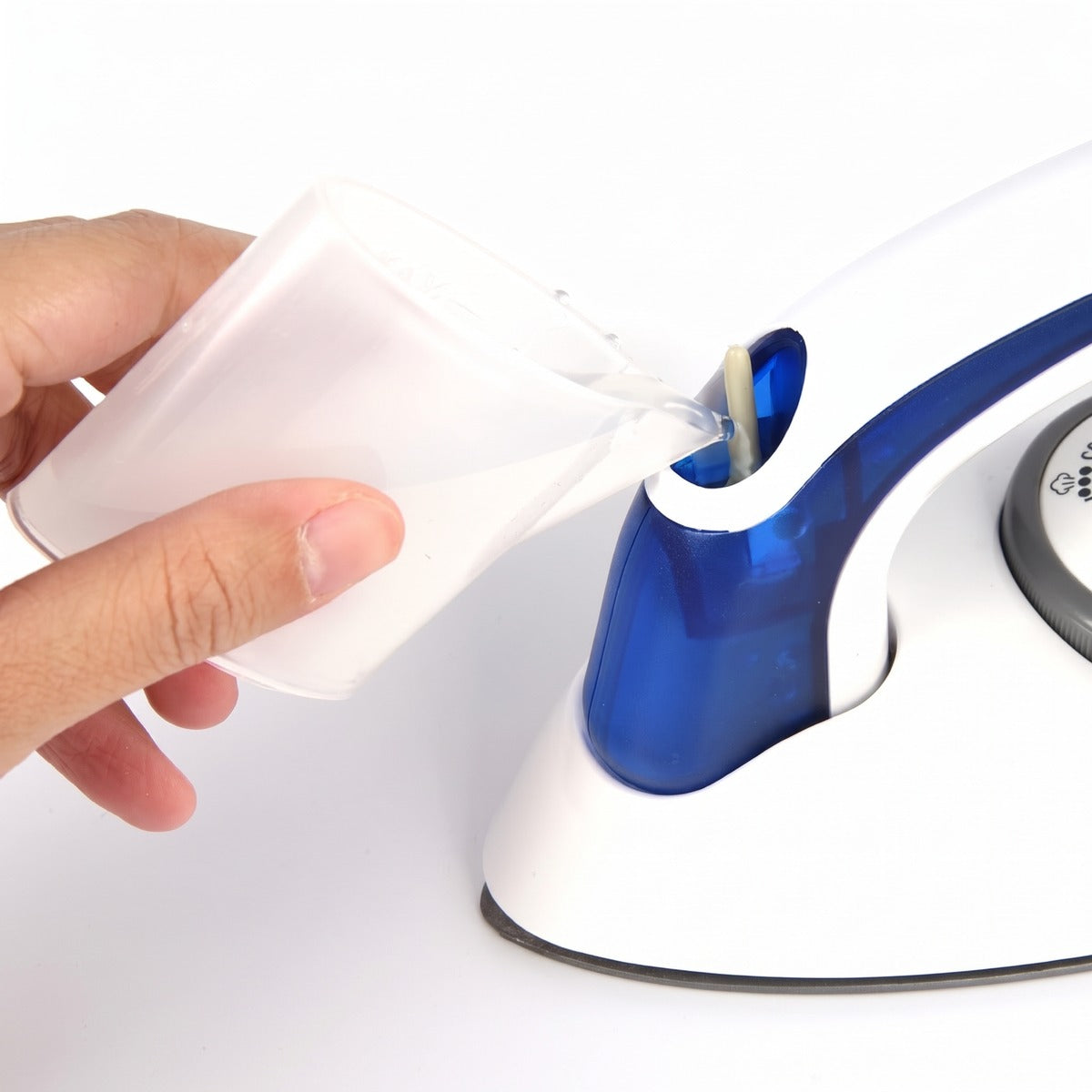 Filling the water tank of the mini travel steam iron