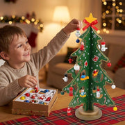 Child decorating the wooden Christmas tree